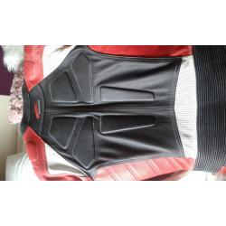 HEIN GERICKE MOTORBIKE ONE PIECE LEATHER RACE SUIT WITH MATCHING GLOVES AND KNEE SLIDERS...AS NEW.
