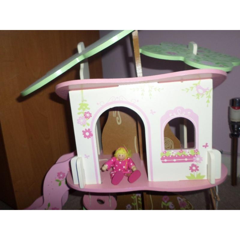Wooden Tree House and Two Dolls