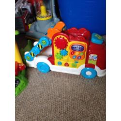 Vtech garage with 2 cars and Vtech truck