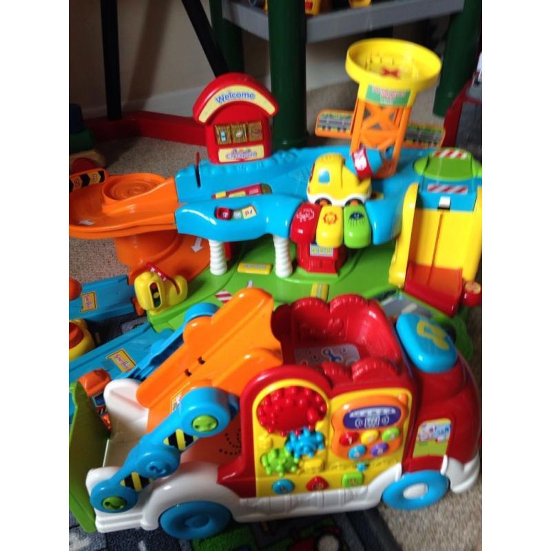 Vtech garage with 2 cars and Vtech truck