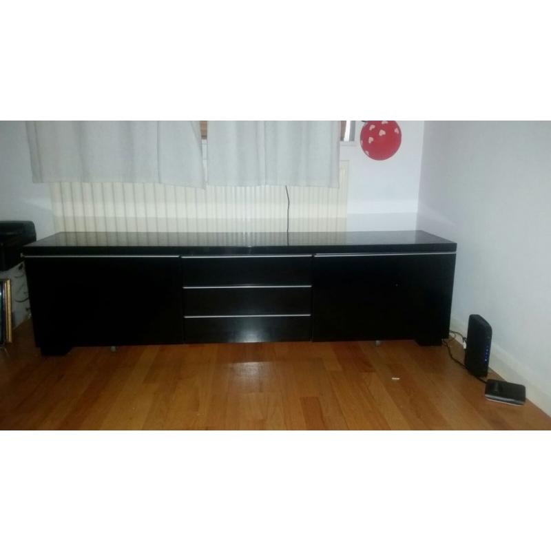 black tv stand with shelfs and storage room