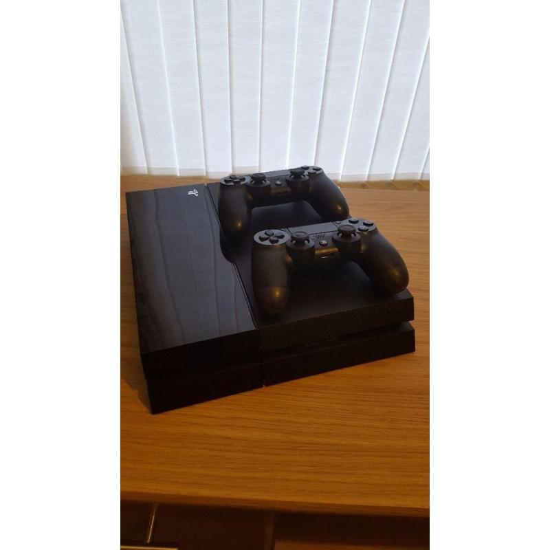 Playstation 4 500gb console - 2 controllers + 4 games ONLY USED HANDFUL OF TIMES.