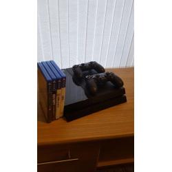 Playstation 4 500gb console - 2 controllers + 4 games ONLY USED HANDFUL OF TIMES.