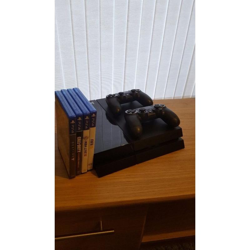 Playstation 4 500gb console - 2 controllers + 4 games ONLY USED HANDFUL OF TIMES.