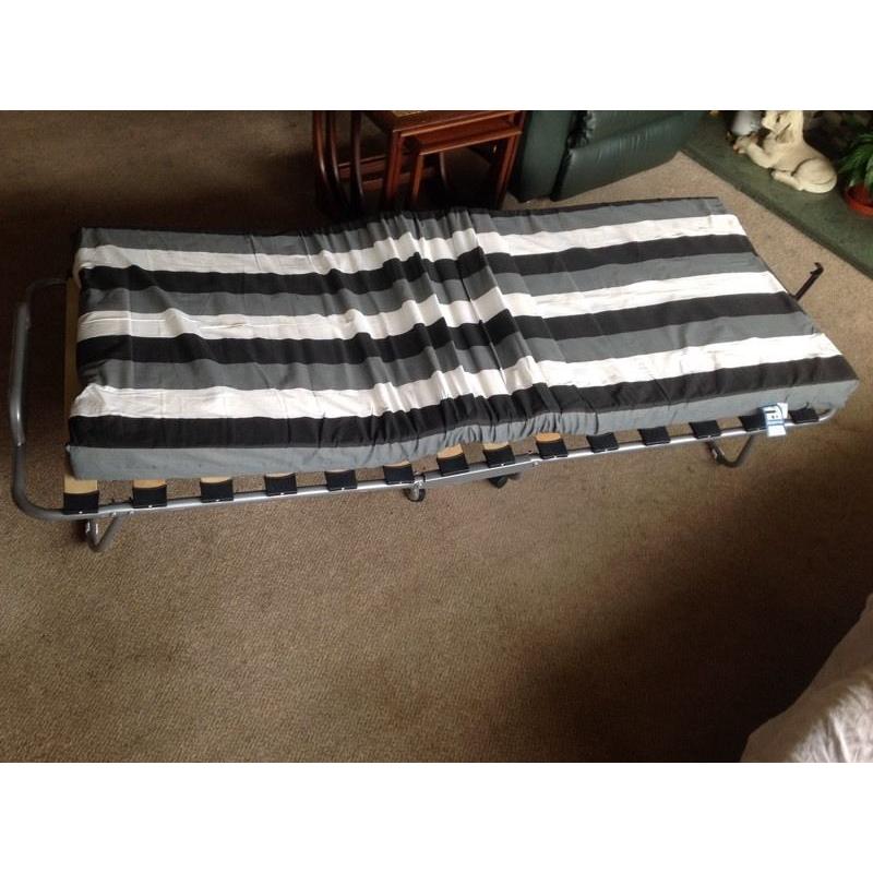 Folding guest bed. Almost new