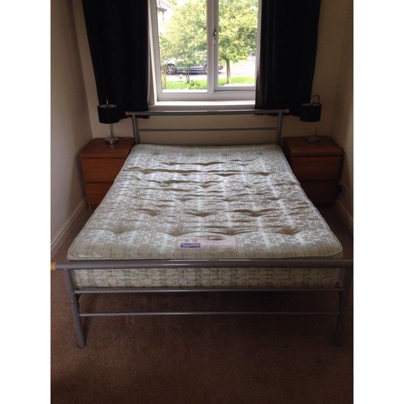 Metal framed double bed with mattress