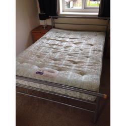 Metal framed double bed with mattress