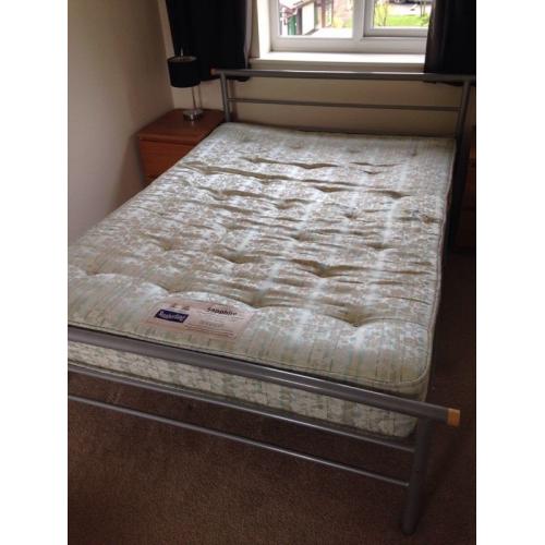 Metal framed double bed with mattress