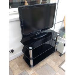 32 inch tv and stand .. Black glass can be seen working