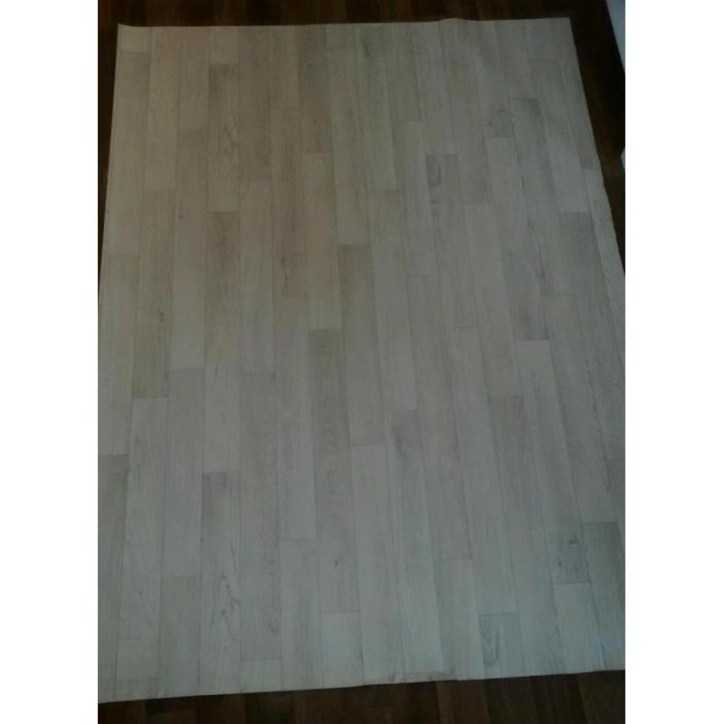 Piece of light grey wood effect lino