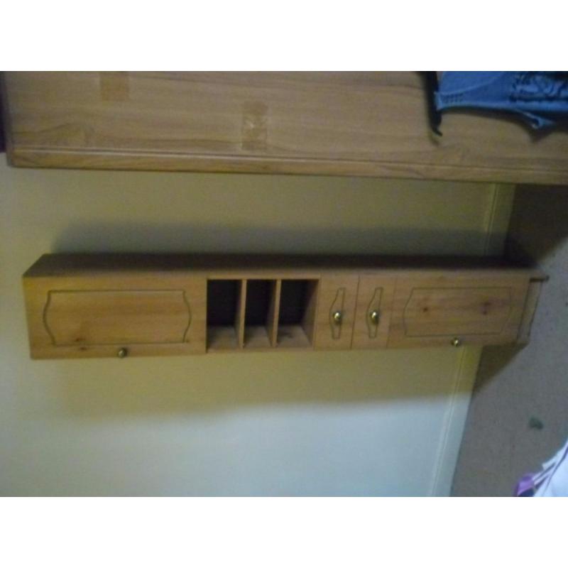 Tall cupboard with drawers ideal for bedroom.
