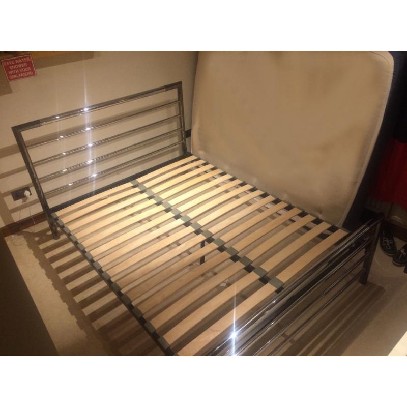 A black steel & chrome king sized bed frame sprung with wooden slats, by Barker & Stonehouse
