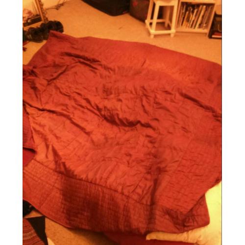Dark red satin throw