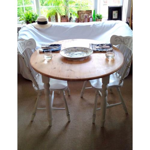 Farmhouse Rustic Shabby Chic Round Table and Two Chairs with Carved Details.