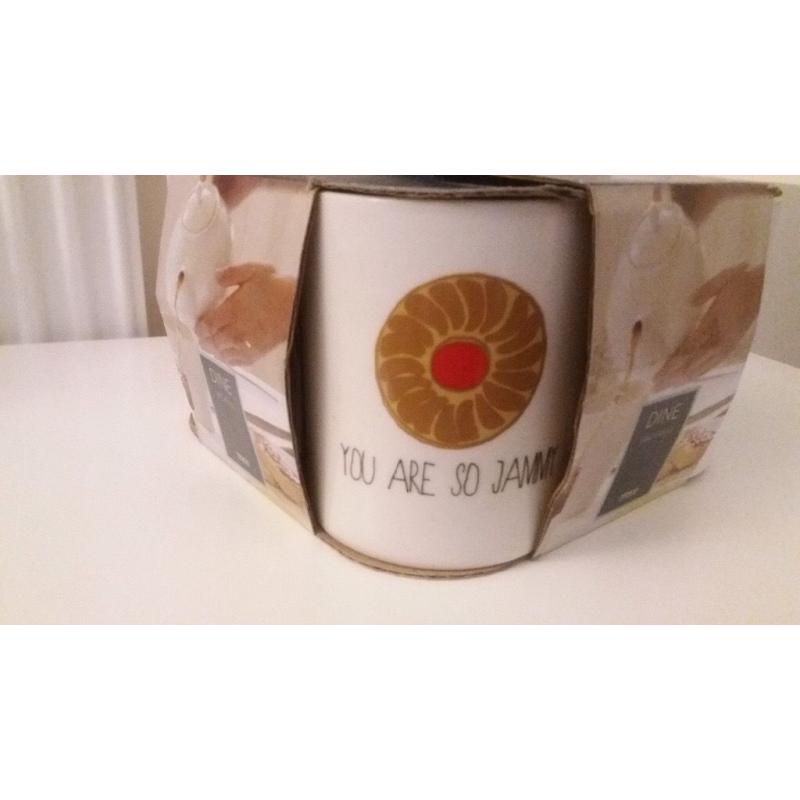 Brand new box of 4 biscuit themed mugs
