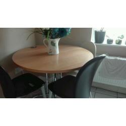 Round dining table and two chairs