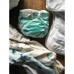 10 cloth nappies, 5 liners and assorted sizes of covers