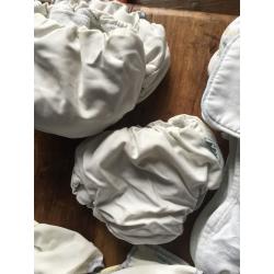 10 cloth nappies, 5 liners and assorted sizes of covers