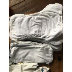 10 cloth nappies, 5 liners and assorted sizes of covers
