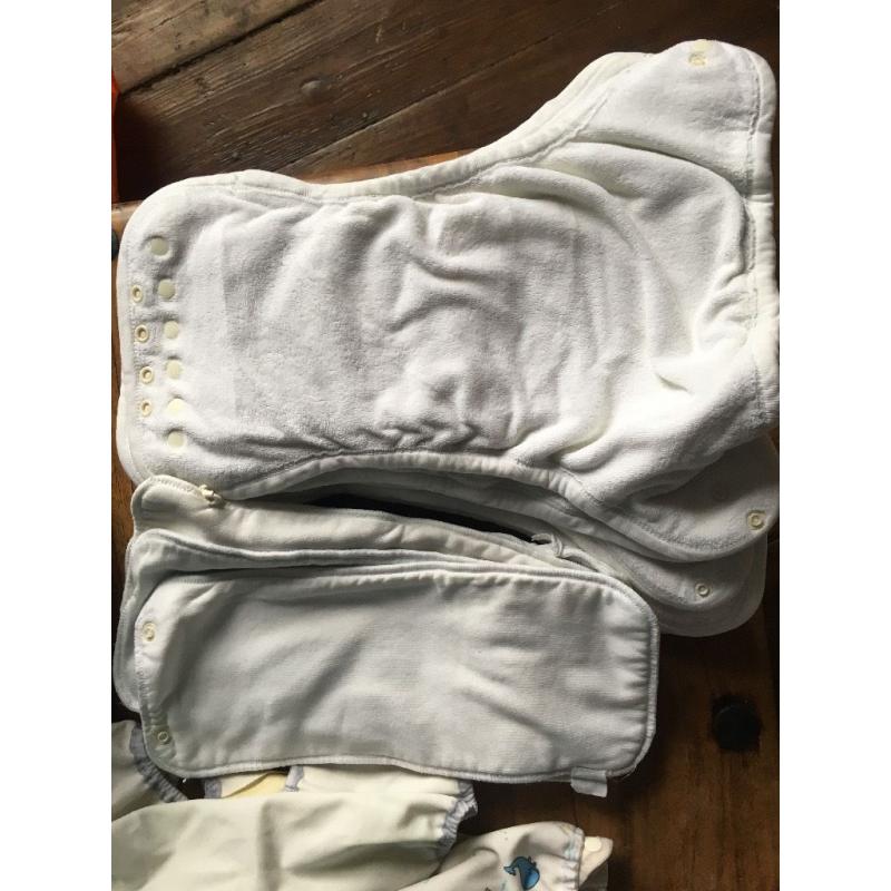 10 cloth nappies, 5 liners and assorted sizes of covers