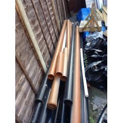 6 lengths of brown drainage pipe with 4 bags of all different connectors