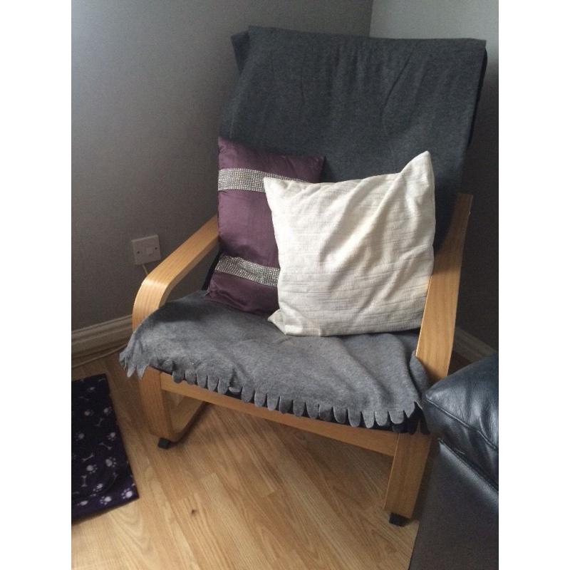 Ikea chair with throws and pillows