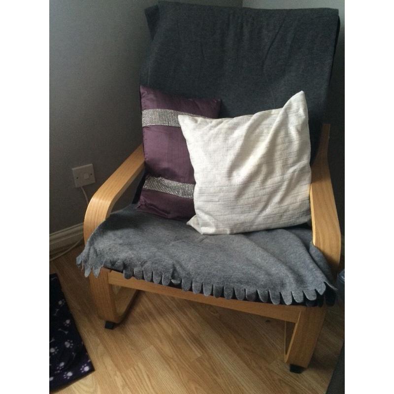 Ikea chair with throws and pillows