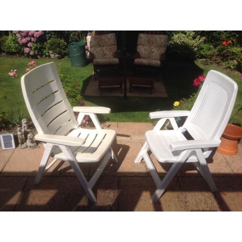 2 plastic garden chairs, not matching,