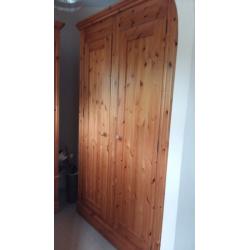 Matching double and single solid pine wardobes