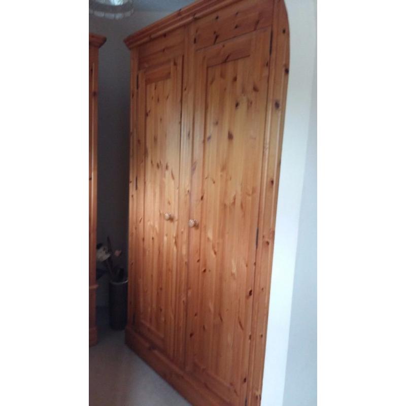 Matching double and single solid pine wardobes