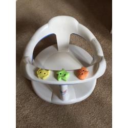 Baby bath seat suctions onto bath