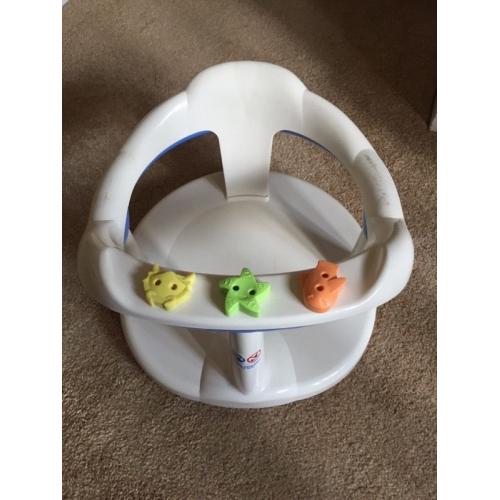Baby bath seat suctions onto bath