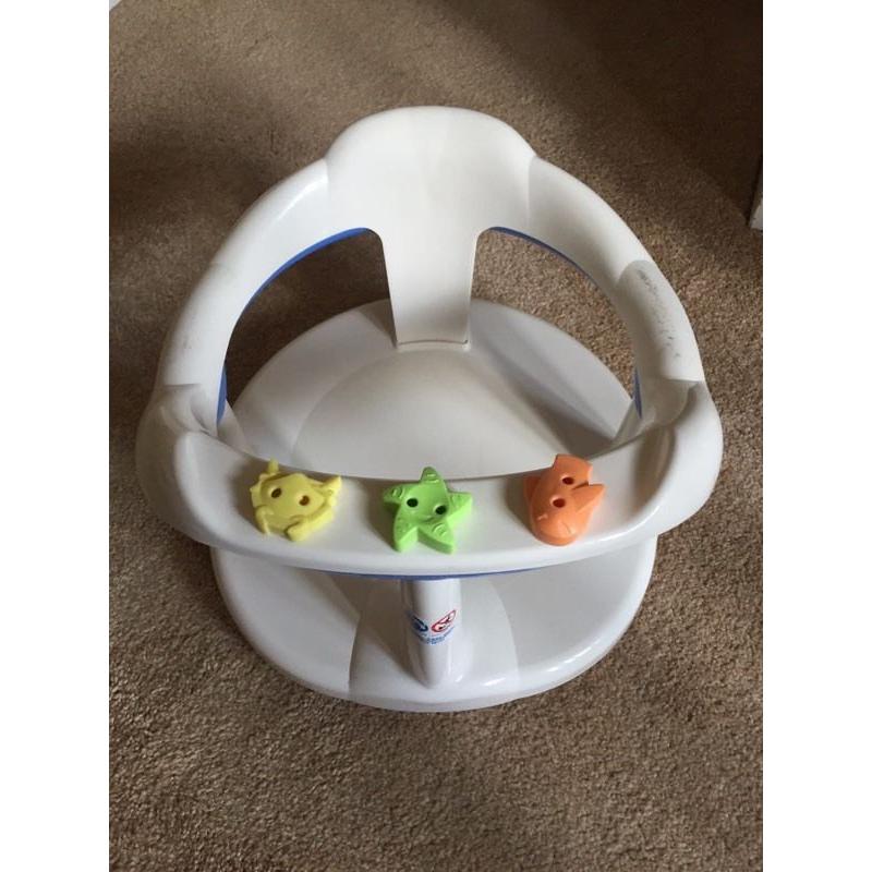 Baby bath seat suctions onto bath
