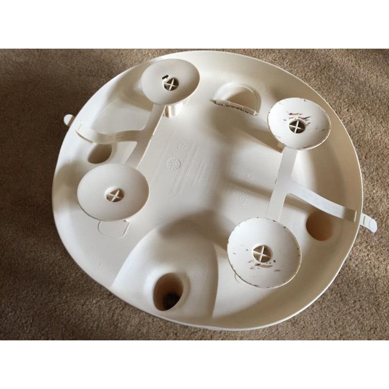 Baby bath seat suctions onto bath