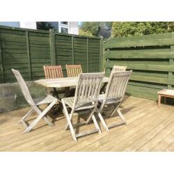 Wooden patio furniture : dining table and 6 folding chairs