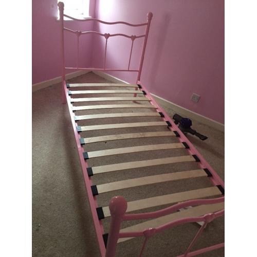 Pink metal single bed