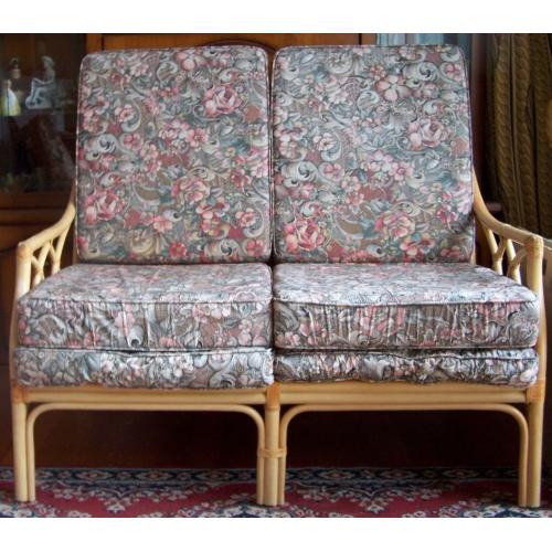 Two seater cane settee with six loose cushions. very comfortable.