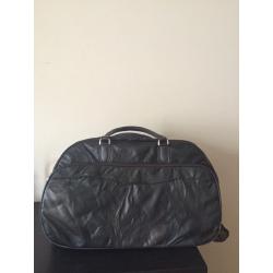 Leather bag with wheels