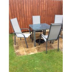 Garden furniture set, perfect condition. W/ 4 chairs, parasol and 16kg parasol weight.