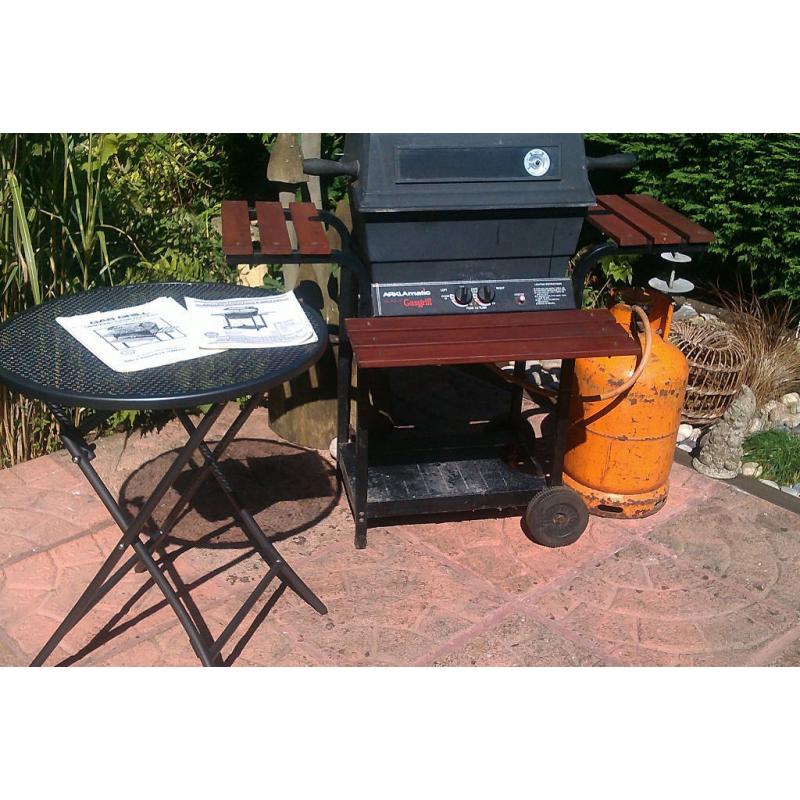 Double burner lava rock gas barbecue including gas bottle and some gas