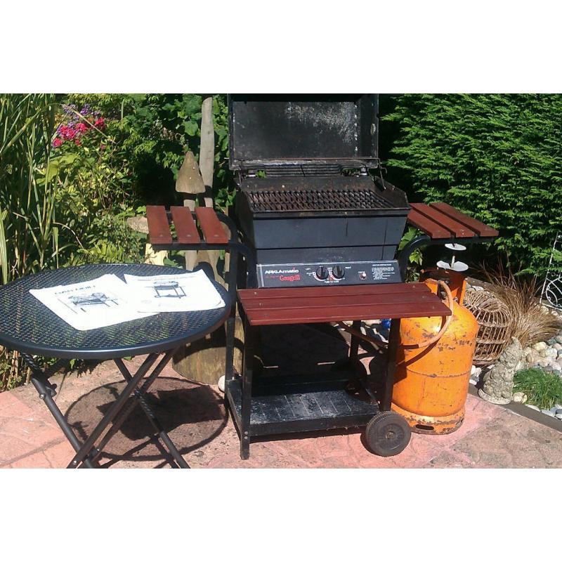 Double burner lava rock gas barbecue including gas bottle and some gas