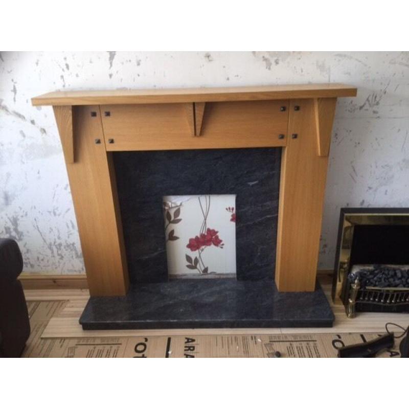 Marble and light oak fireplace