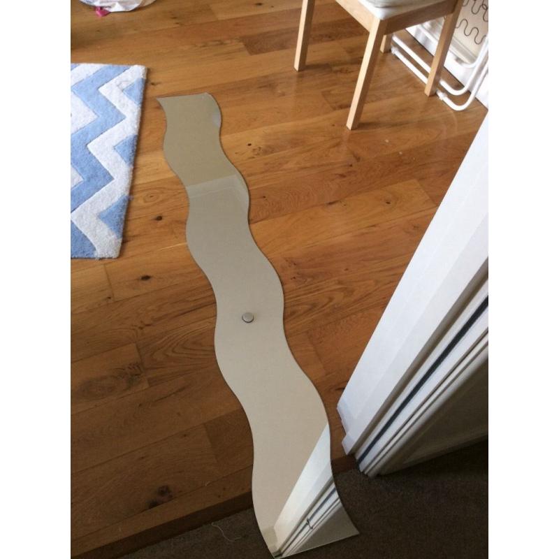 IKEA wave mirror. Slightly damaged corner