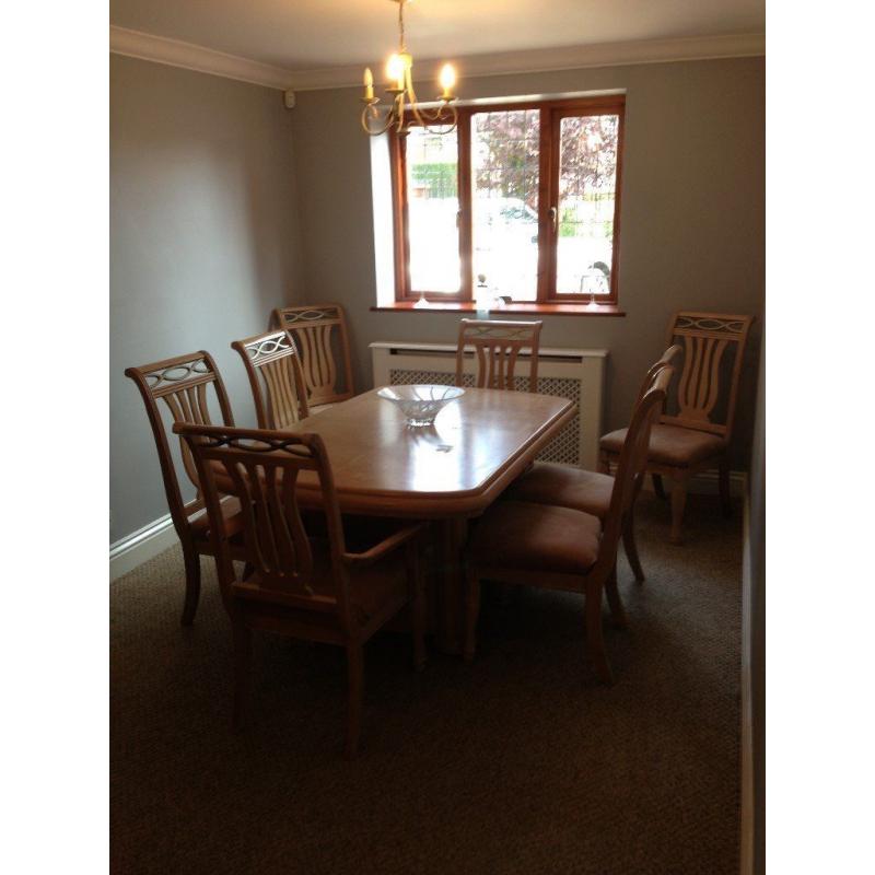 Limed oak dining table, 6 chairs, 2 carvers and large cabinet to match