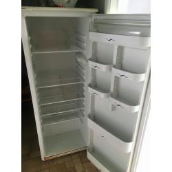 Appliances: Refrigerator and Apartment Stove. 2 long tables.