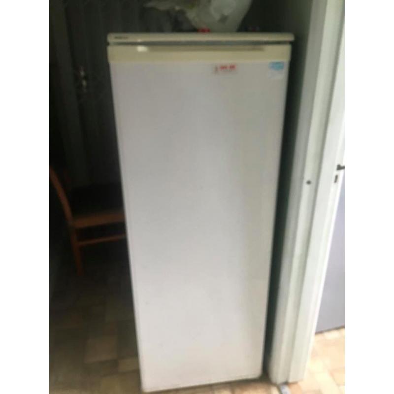 Appliances: Refrigerator and Apartment Stove. 2 long tables.