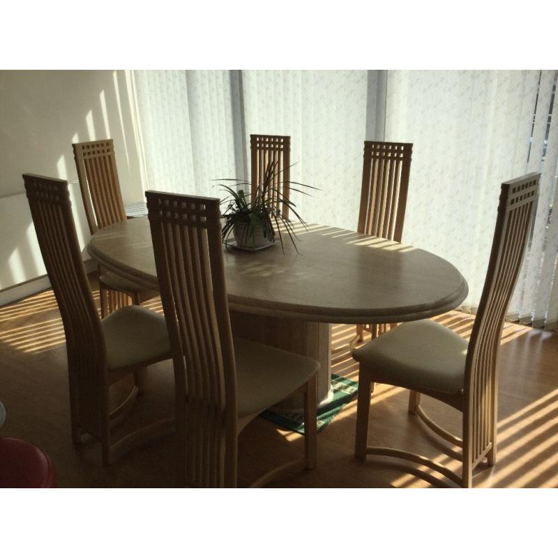 Large marble dinning table and six chairs .
