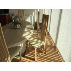 Large marble dinning table and six chairs .