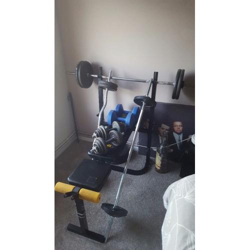 Weight bench over 180 kilos steel weights a mixture of bars and dumbells