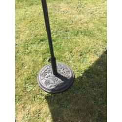 New large green parasol and heavy metal base
